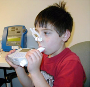 child performing spirometry